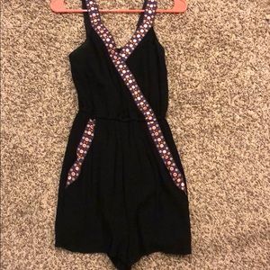 Black romper with designs